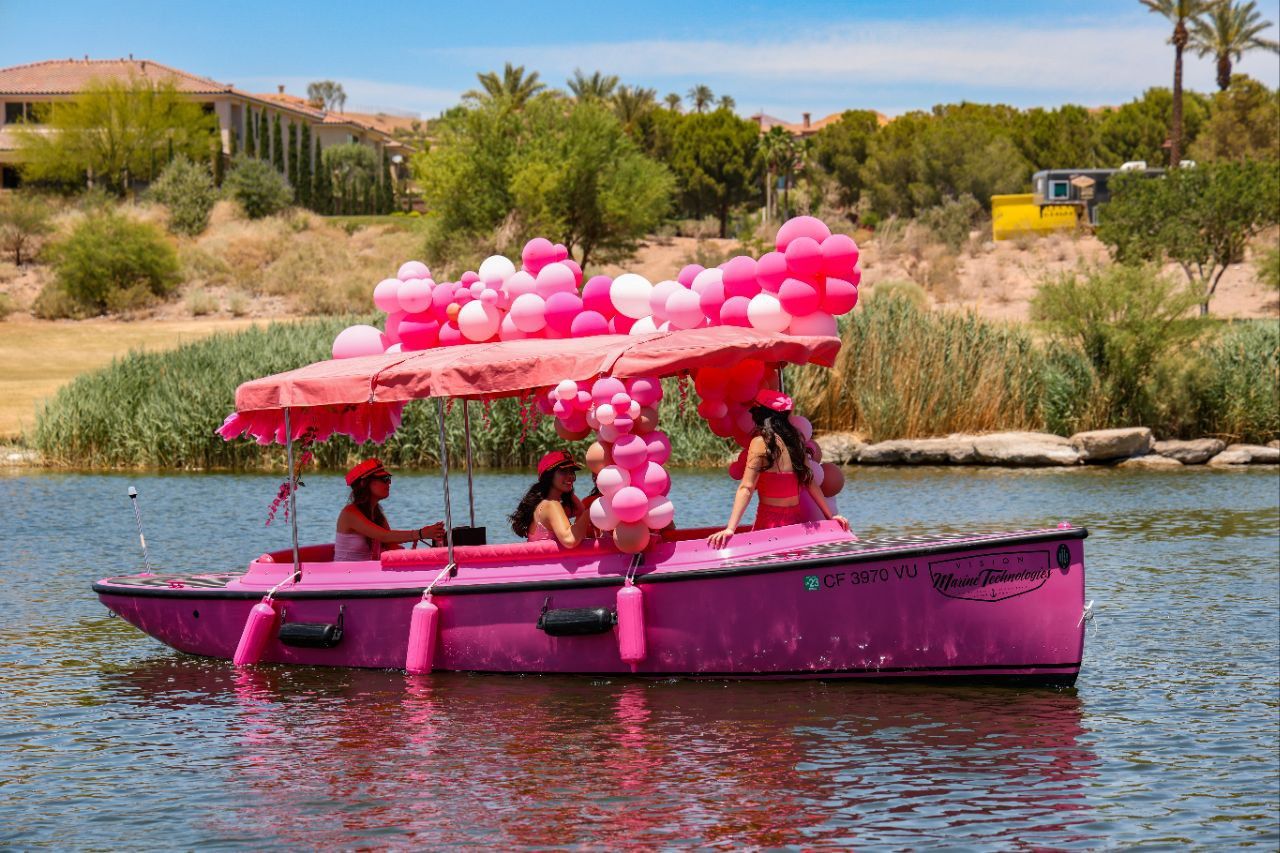 The pink Duffy electric boat on Lake Las Vegas